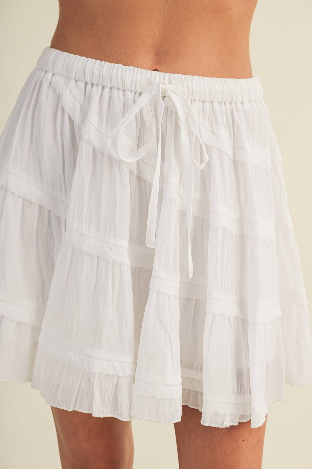 White mini skirt with ties 