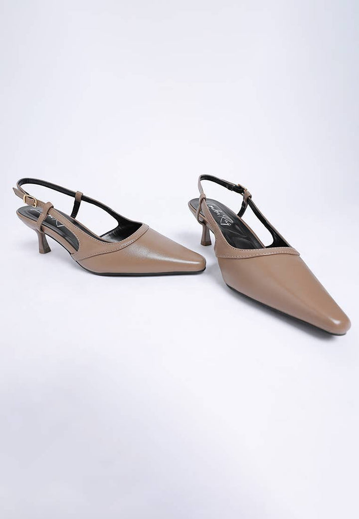 A Styled Collective beige faux leather kitten heel slingbacks with a sharp snip toe and adjustable buckle strap.