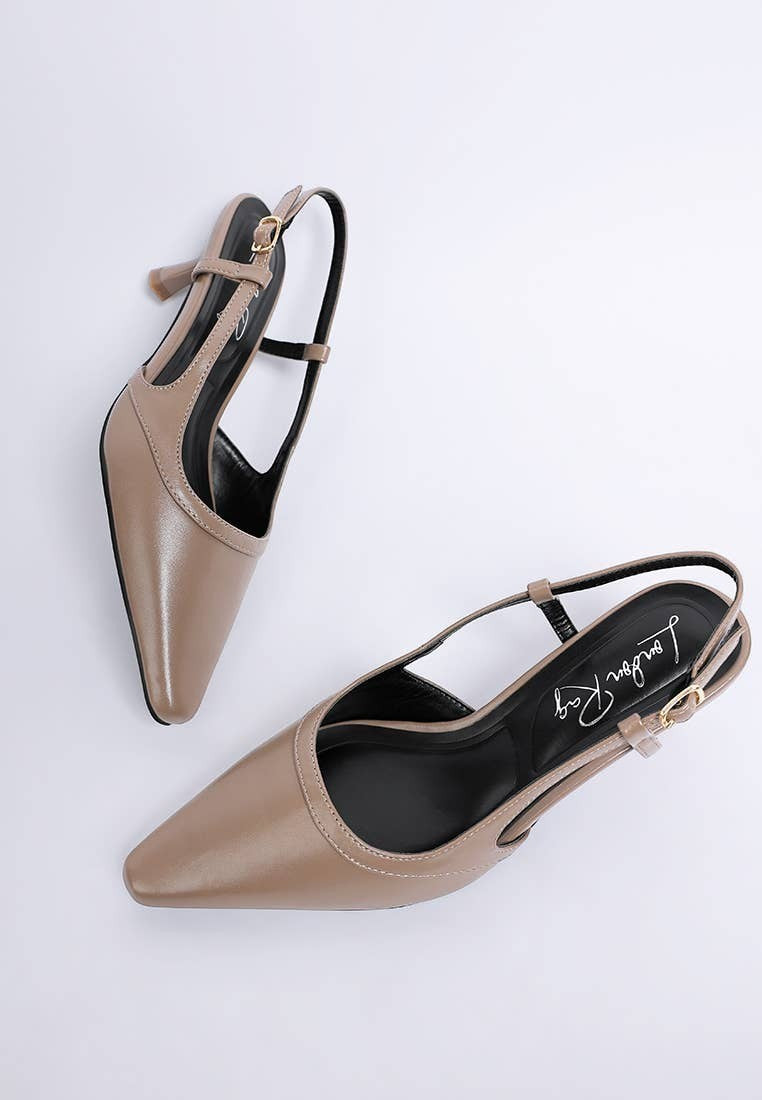 A Styled Collective beige faux leather kitten heel slingbacks with a snip toe and adjustable pin buckle strap.