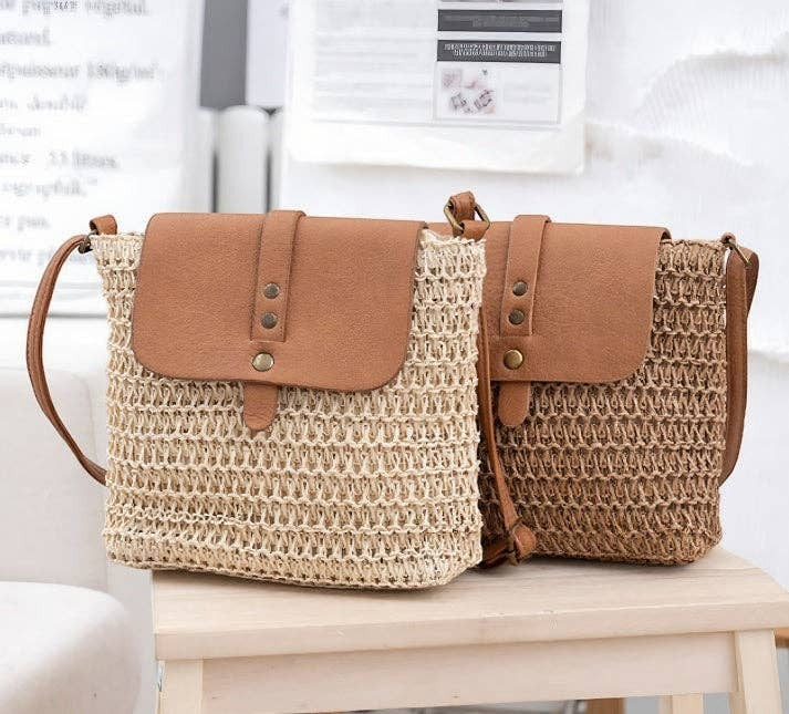 A Styled Collective patchwork straw crossbody bags with tan faux leather flaps and adjustable shoulder straps